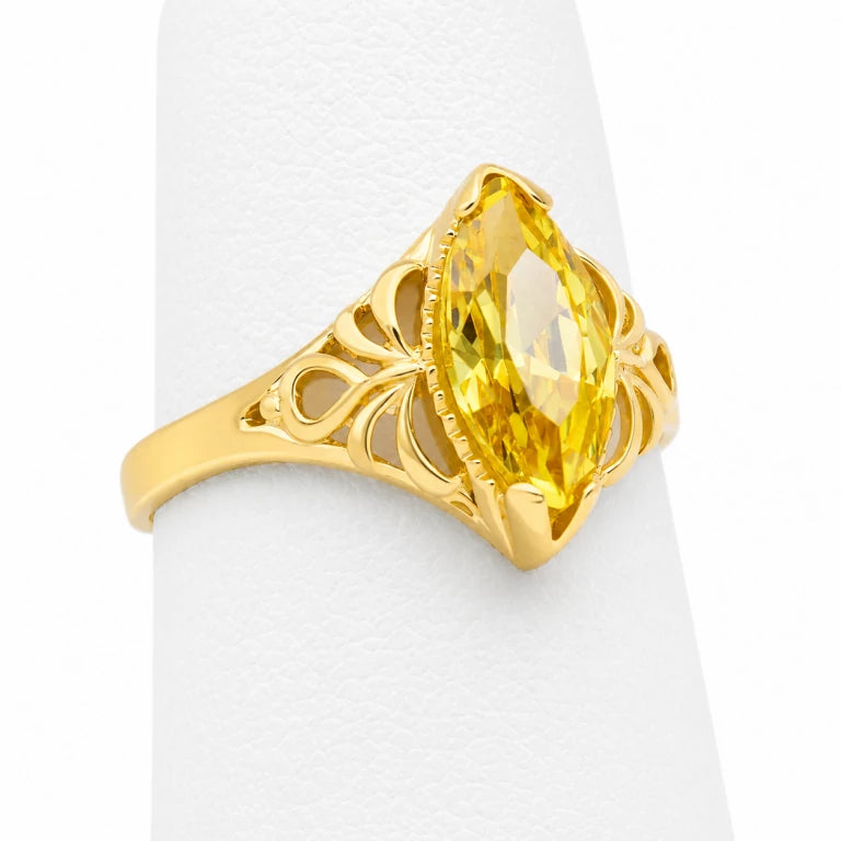 Anillo marquesa de oro para mujer con piedra de circonia amarilla, diseño calado y acabado brillante.