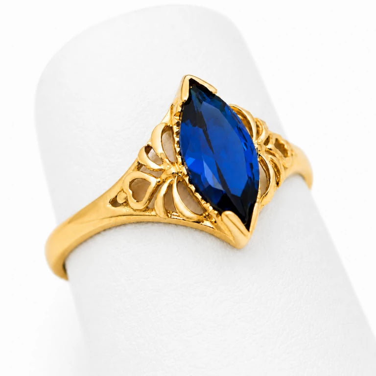 Piedra azul oscuro: Anillo solitario marquesa de oro para mujer con piedra de circonia azul oscuro de 11 x 5.5 mm.
